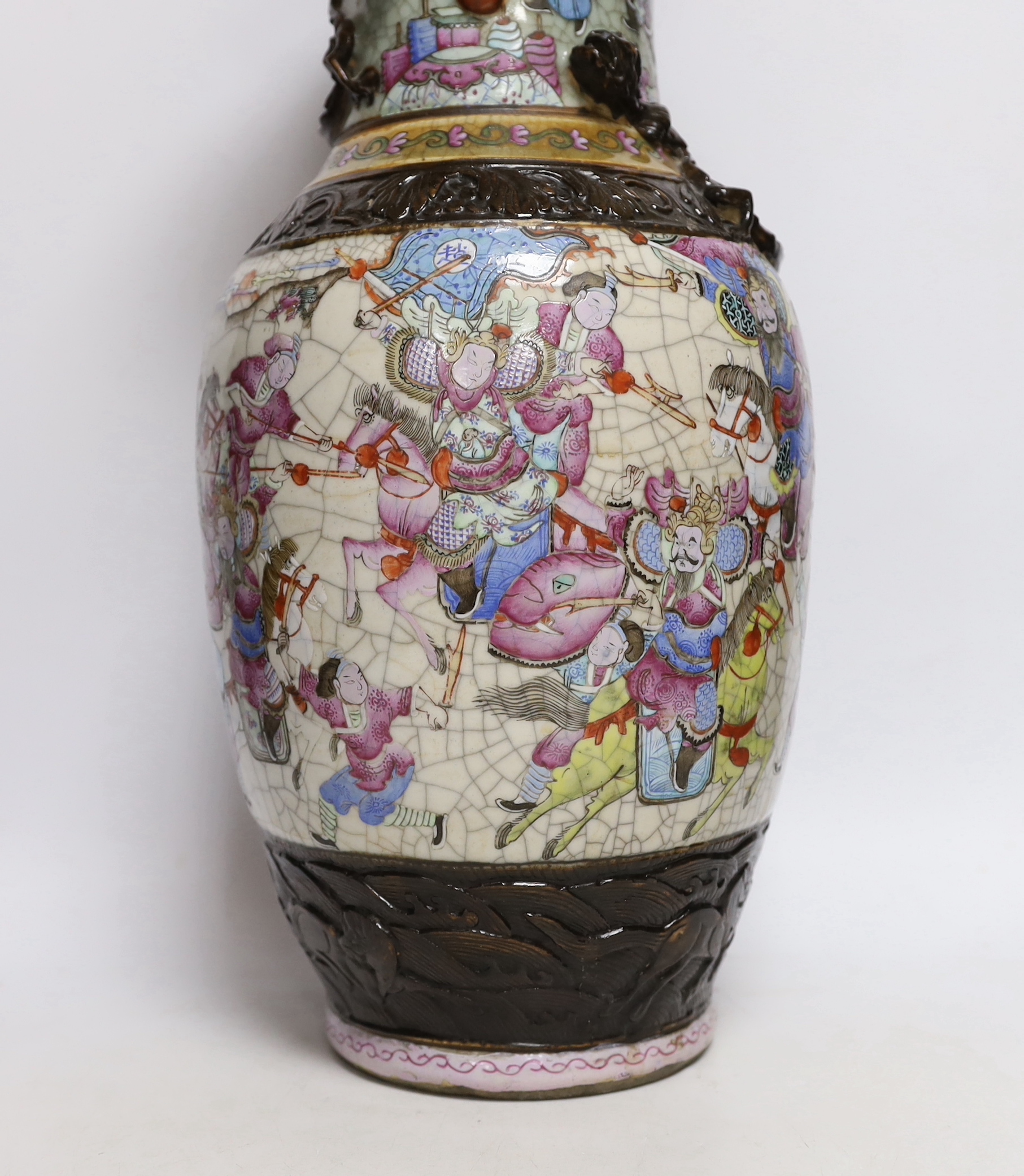 A Chinese famille rose crackle glaze 'warriors' vase, late 19th century, 46cm high, cracked